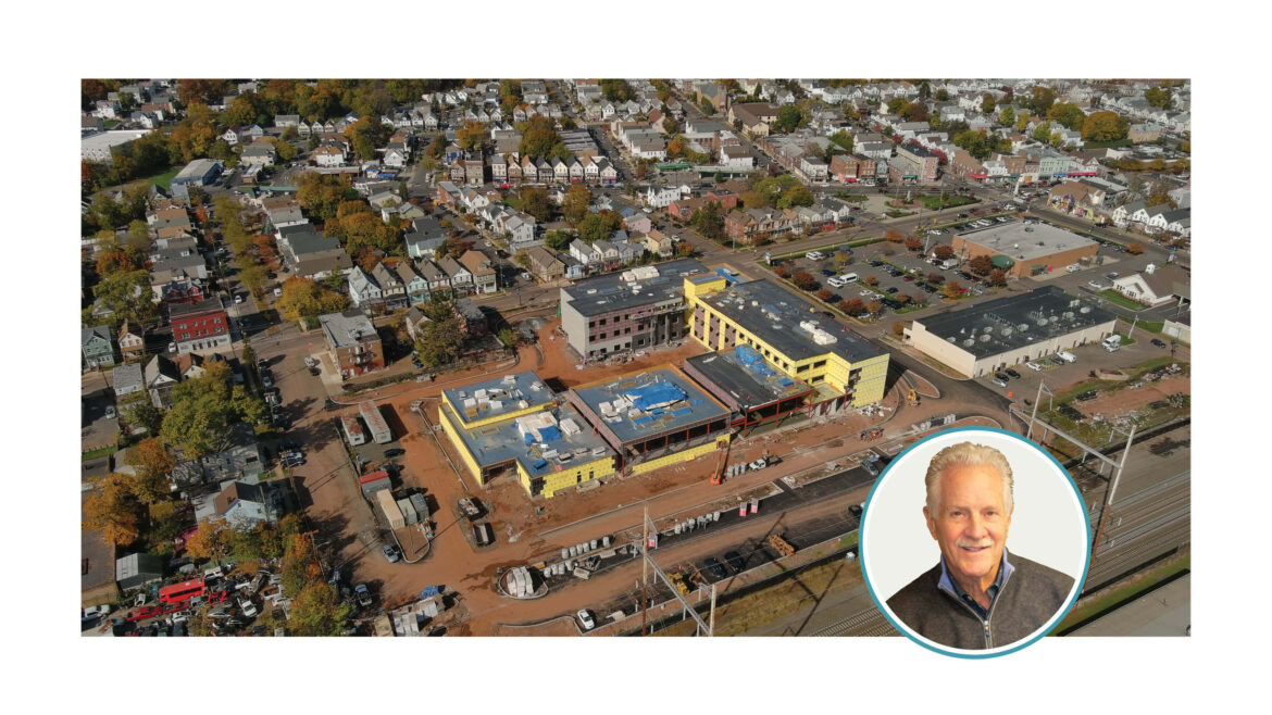 A drone view of a building under construction and the author's photo.